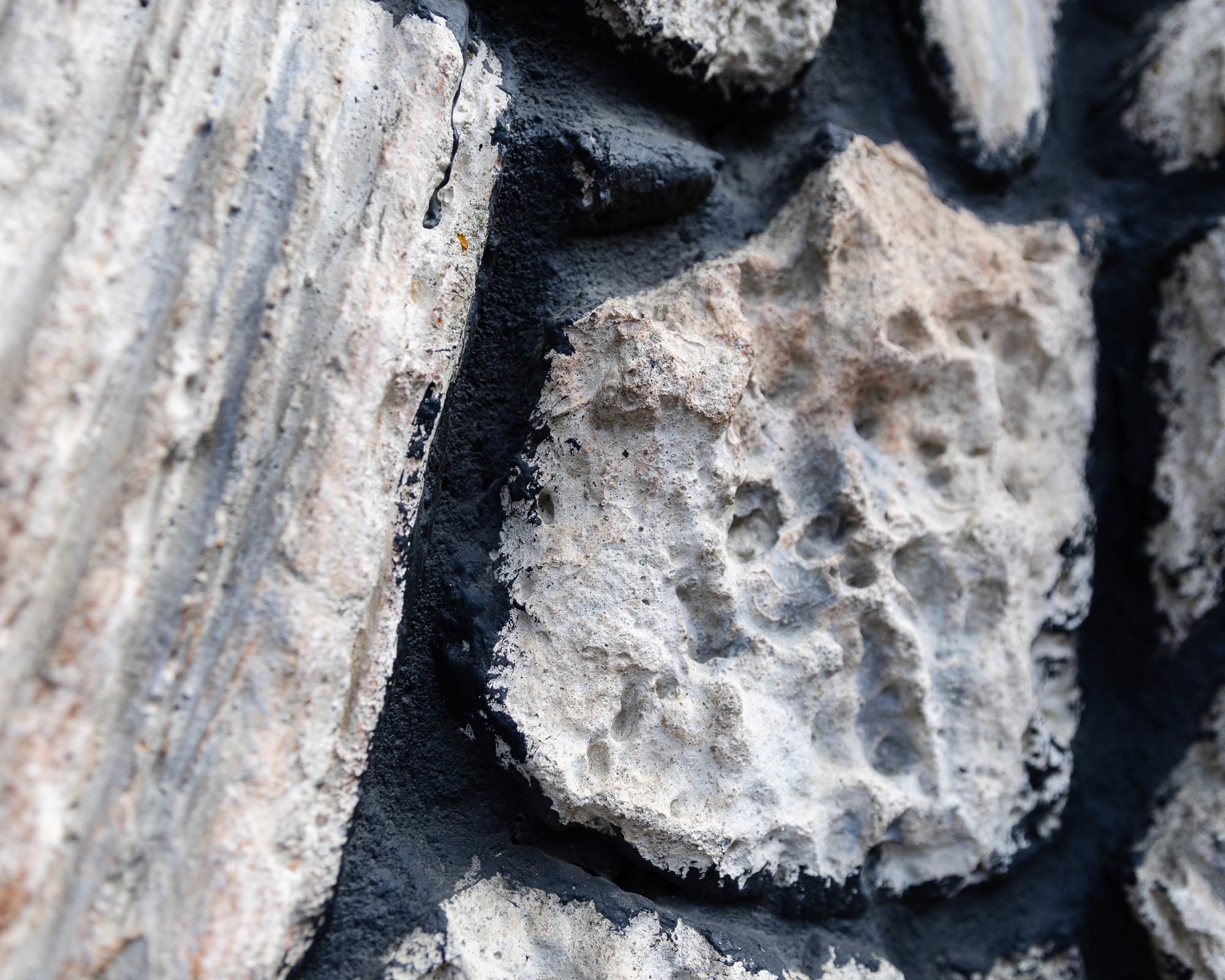 Close-up of the concrete false rocks mounted to the facade of Esther's Orbit Room