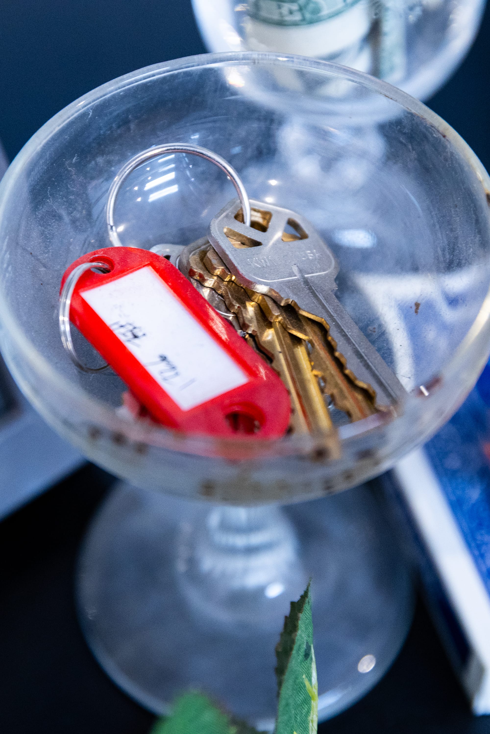 A coupe glass holding keys