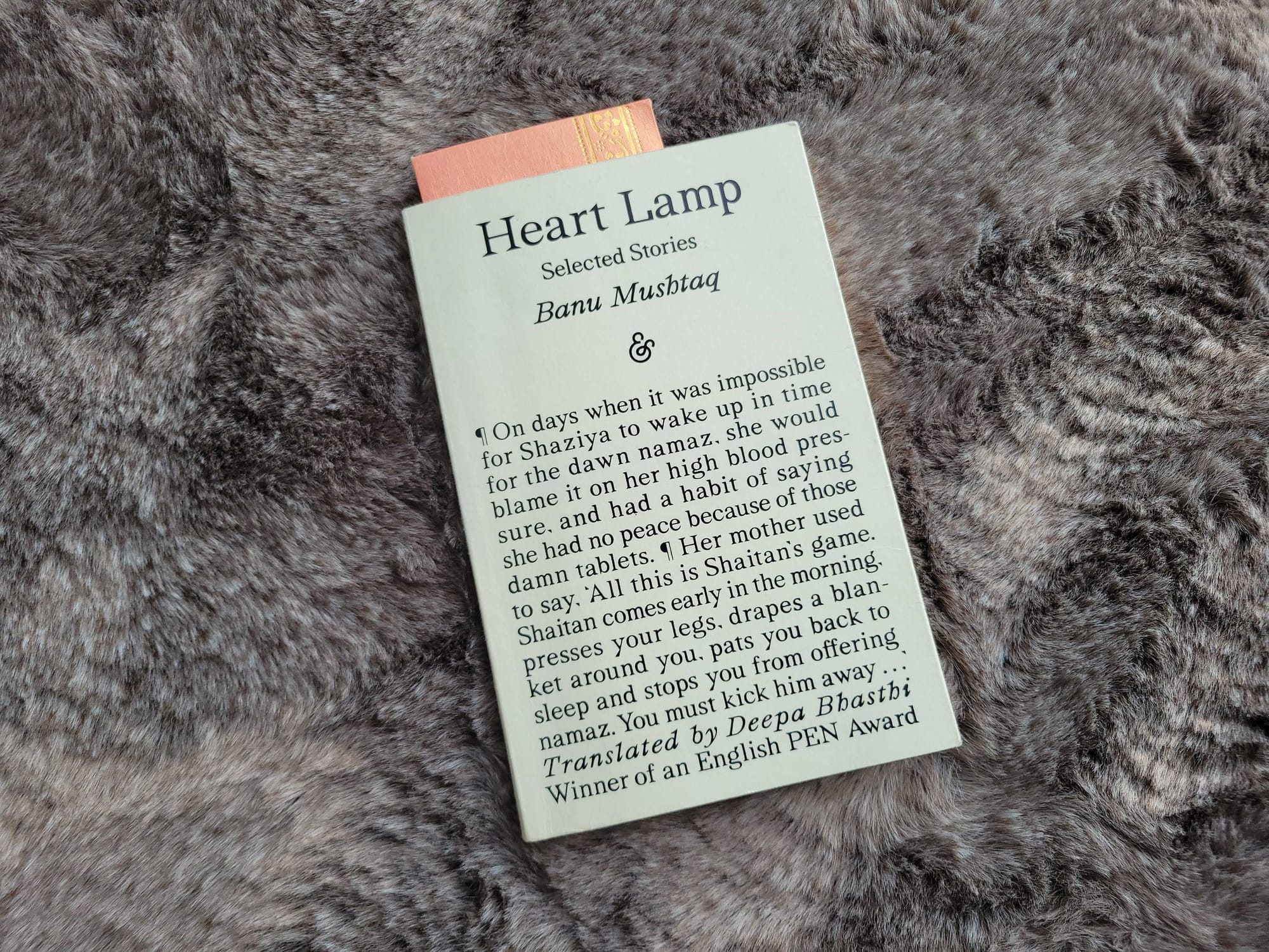 The book Heart Lamp against a grey fur rug.