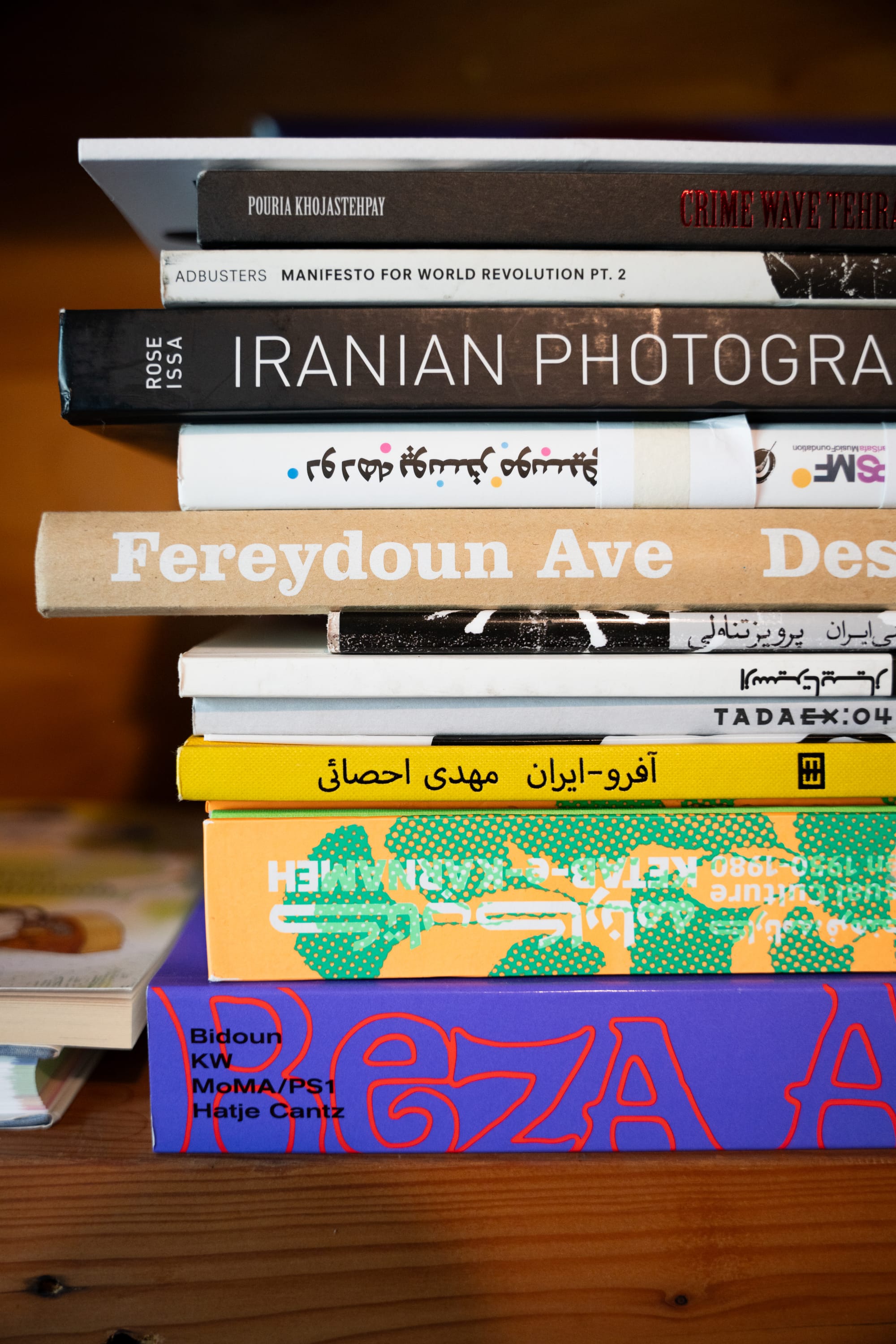 Stack of books on Iranian art and photography.